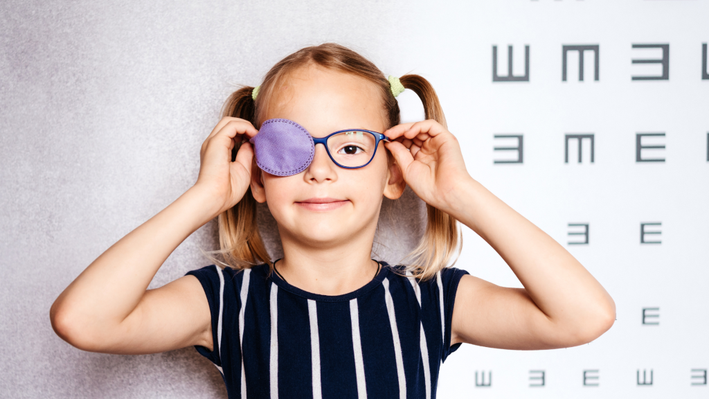 Child receiving amblyopia treatment for lazy eye during pediatric vision therapy